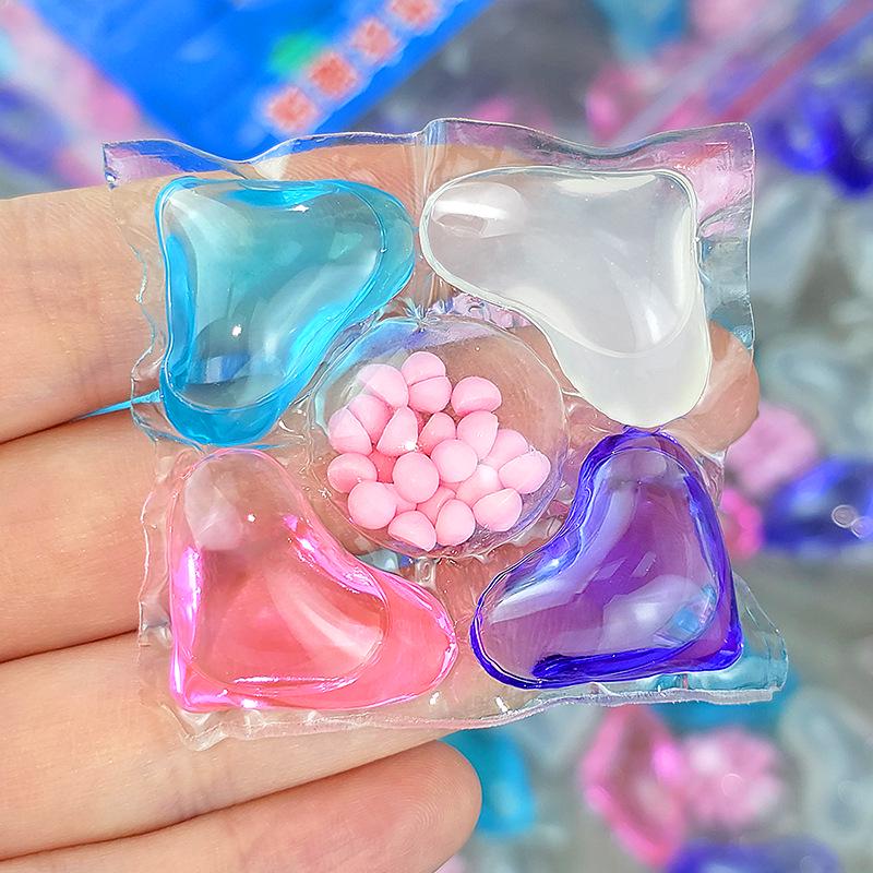 100-piece pack of five-in-one laundry pods with fragrance, softening, stain removal, and five-chamber design.