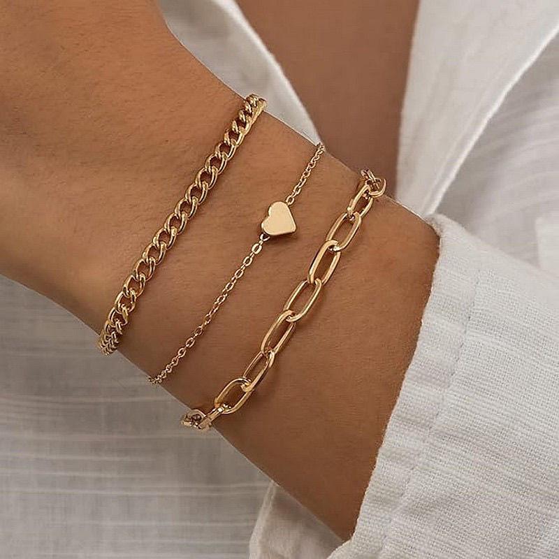 

AdjustablePunk Snake Bone Chain Bracelet with Heart Pendant .Bohemian Multi-Layer Golden-Tone Chain Jewelry forWomen, Edgy Retro