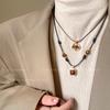 Tiger's eye stone pendant, leather rope necklace, autumn and winter medieval light luxury decorative sweater chain, versatile accessories