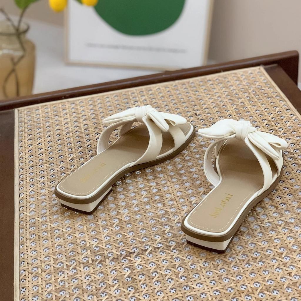 Stepping on shit slippers women wear 2025 new summer Internet celebrity fairy wind bow wedge soft bottom one-word