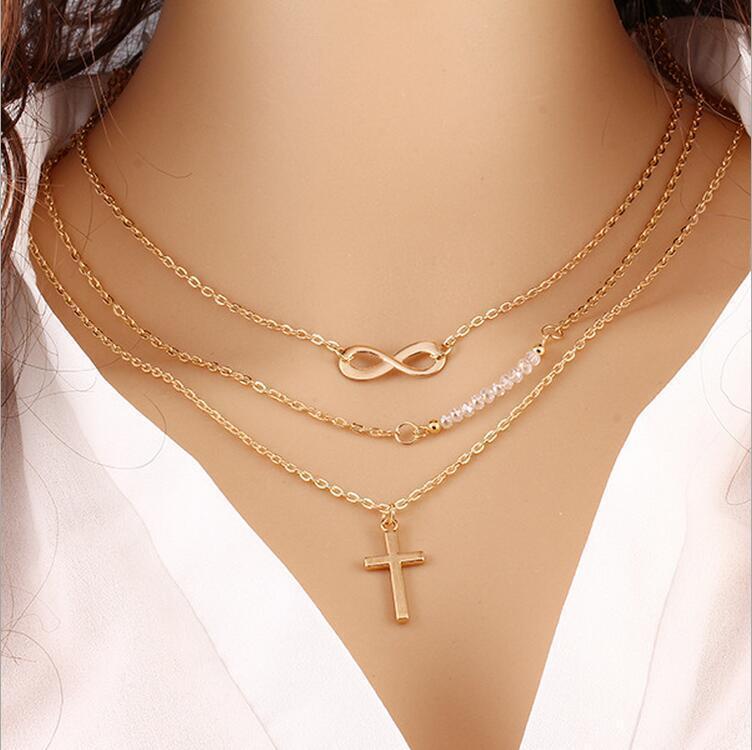 

Trendy temperament Multi-layer metal cross inverted 8 collarbone chain Rice bead versatile necklace срібний