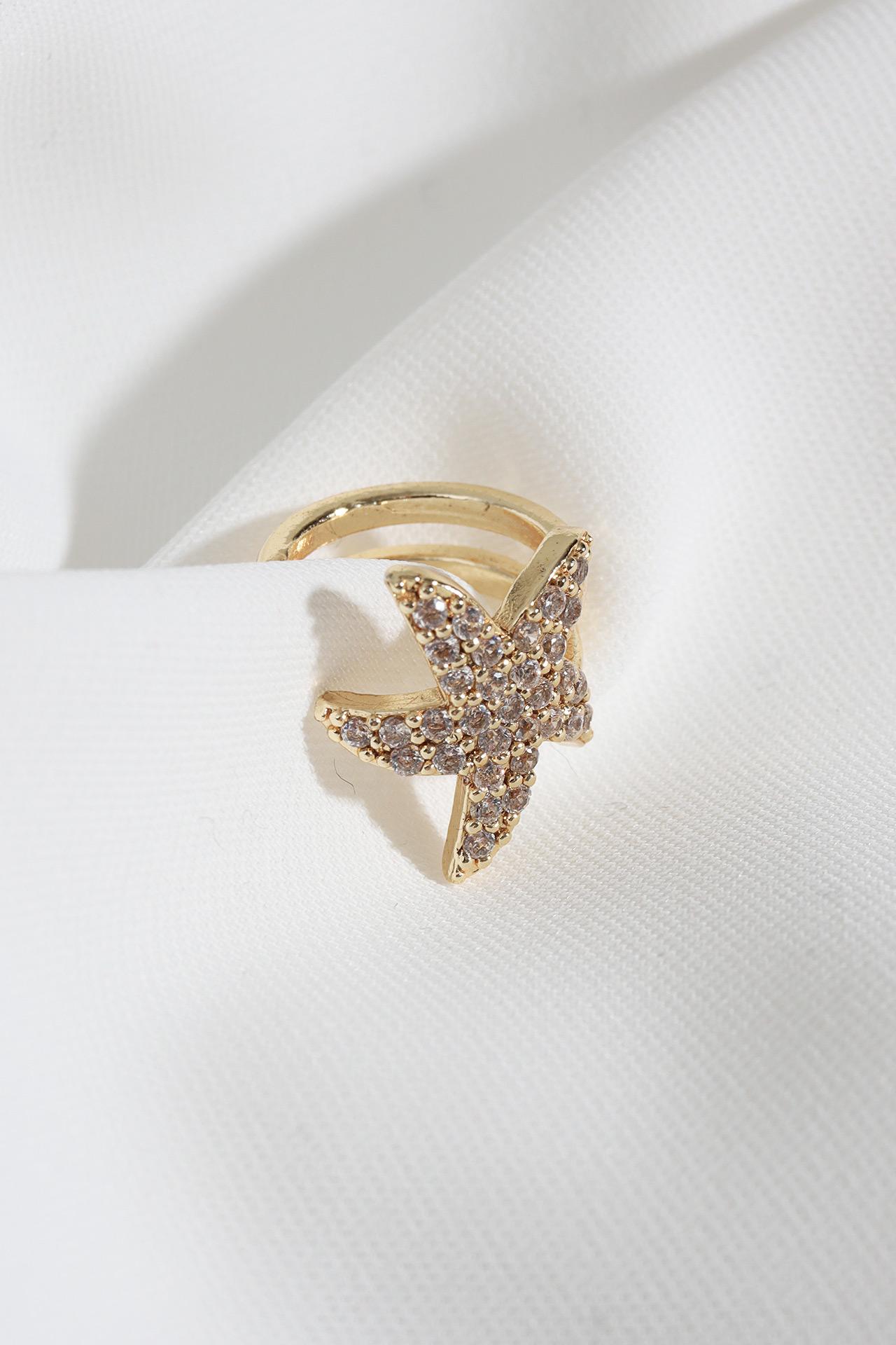 

Серьга из хряща золотого цвета со сжатой звездой