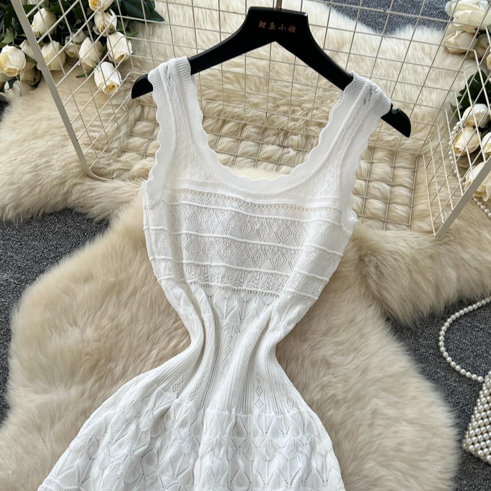 French white sleeveless knitted dress women's summer new cold hollow waist thin A-shaped skirt thousand gold style
