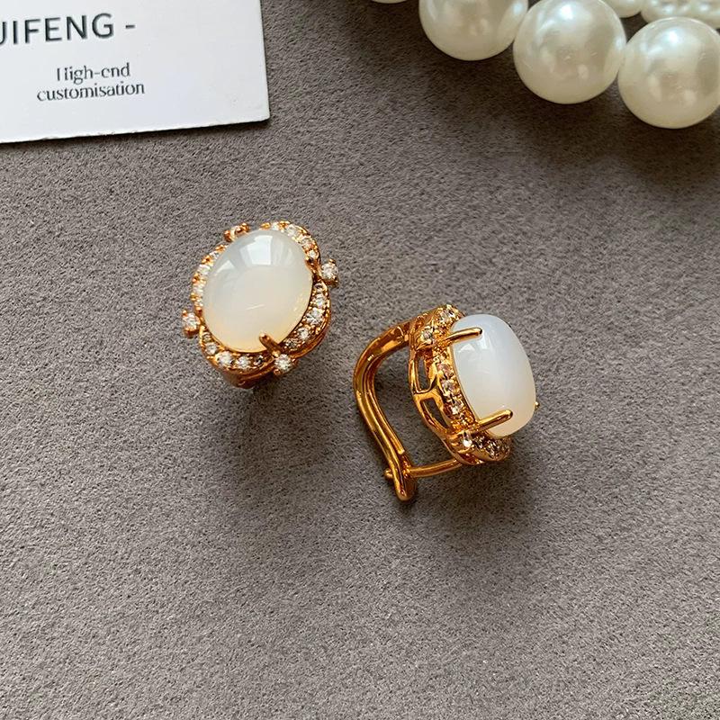 

Sterling silver needle light luxury new Chinese retro round egg surface white chalcedony small temperament stud earrings women s ear jewelry