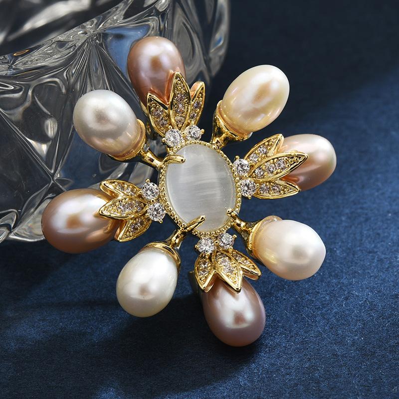 

Brooch: high-end, niche, vintage-inspired brooch with natural freshwater pearls and minimalist zircon accents