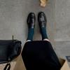 The New Style of Shoes Features A Retro Thick Heel and A Pair of Leather Shoes
