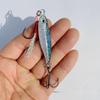 Luminous Blue Knife Iron Plate Lure with Double Hooks for Long Casts, Sea & Freshwater Fishing.