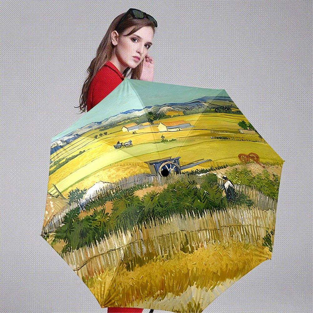 Folding Umbrella The umbrella features a landscape with yellow wheat fields, a rural scene, and a figure resembling a farmwork