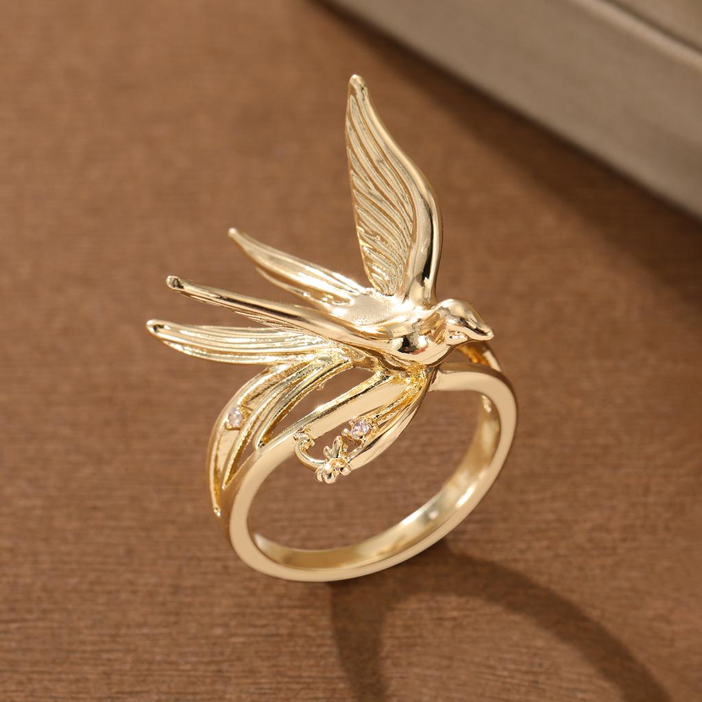 Elegant swallow-shaped copper ring with tiny inlaid artificial gems for women, suitable for dating and daily matching.