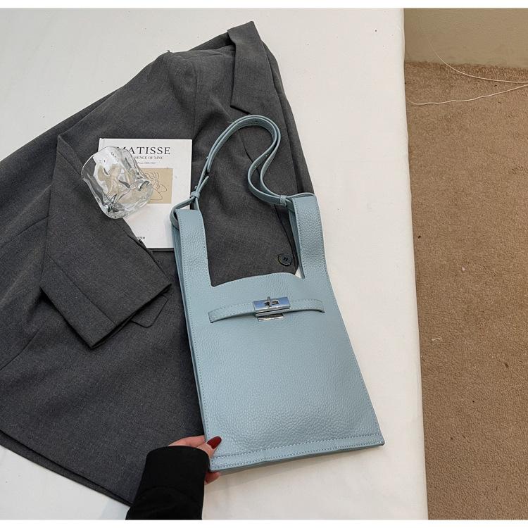 

2025 spring new women s bag solid color vertical Kelly large capacity lock mobile phone bag crossbody niche design women s bag синій