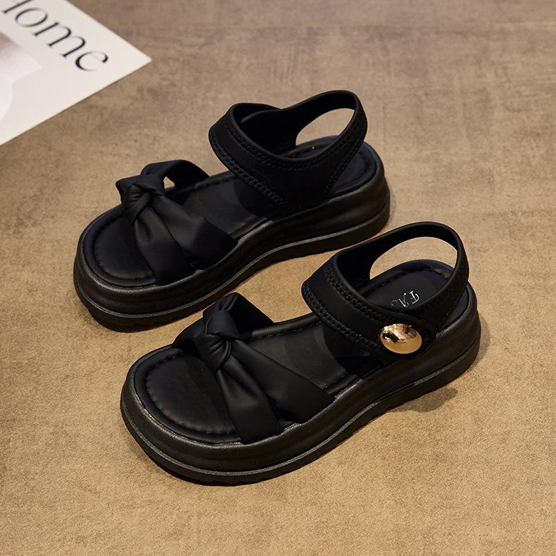 

Stepping on shit sandals girl 2025 summer new fairy wind bow muffin thick bottom wear non-slip cool slippers girl 41 чёрный