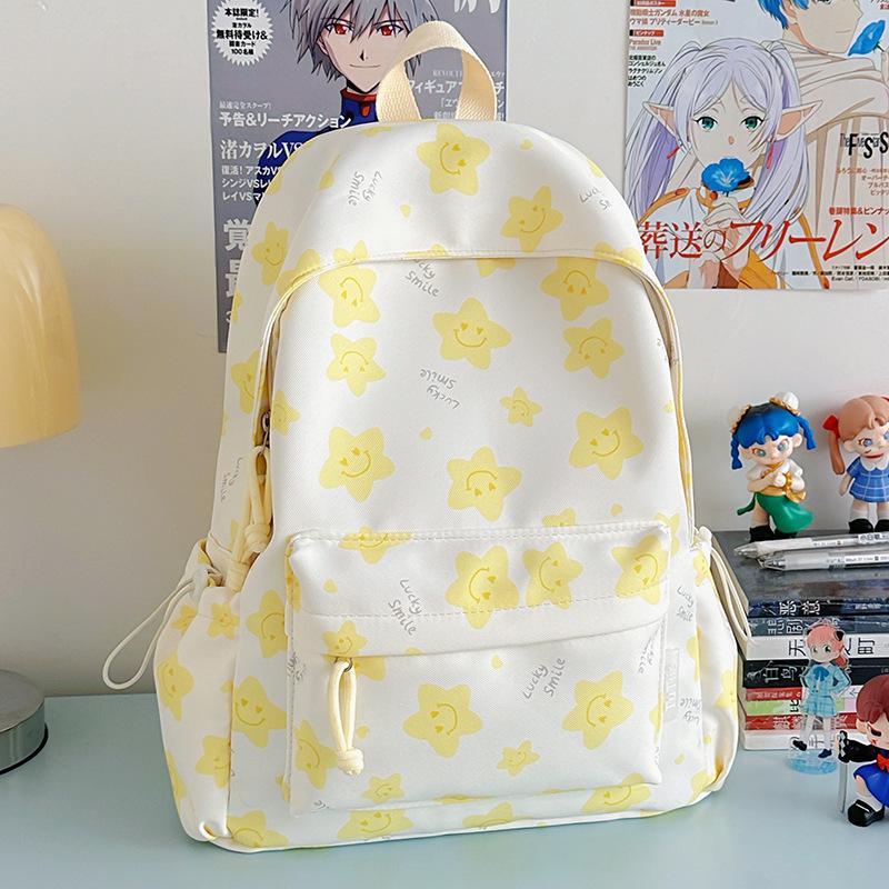 Nowy tornister jest wysokiej jakości, świeży, słodki i uroczy, a plecak w gwiazdki to lekki plecak podróżny dla uczniów gimnazjum.