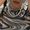 Wearing a holiday-style shell special-shaped imitation pearl multi-layer necklace, with a cold temperament and an oil heart-shaped necklace.