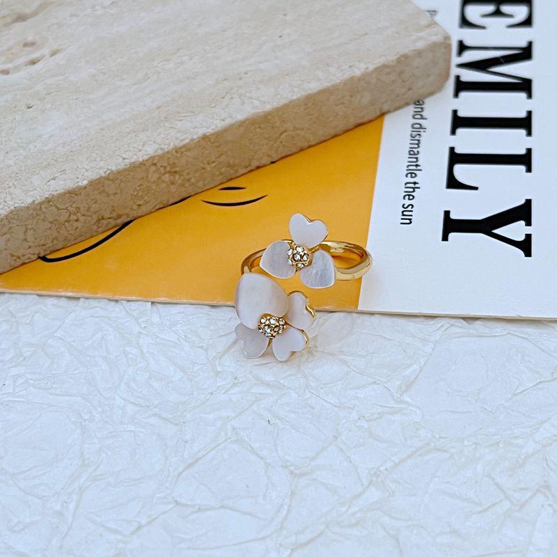 

Елегантна металева каблучка з квіткою з натуральної мушлі Size 6 золотий