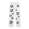EastRogue High Street Hip Hop Streetwear Loose Fit Men's and Women's Denim Jeans with Washed Effect and Full Print of Hibiscus Flowers.