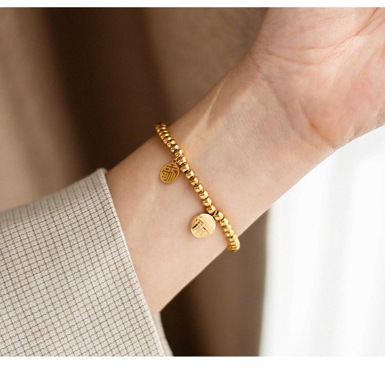 Japonsko-korejský 3D náramek z titanové oceli se zlatými postavami Fu a Xi a tykví - Jednoduchý, elastický design