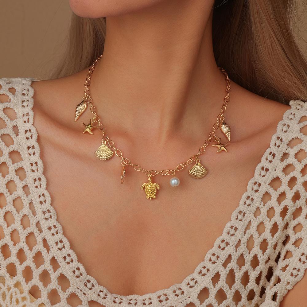 

Handmade Starfish Shell Turtle Butterfly Zinc Alloy Necklace with Pearl Pendant Ocean Theme Beach Jewelry Accessories for Women 35cm
