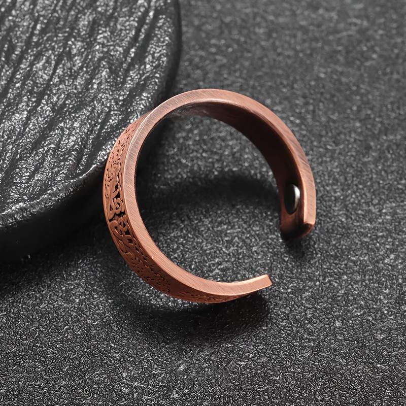 A vintage bohemian-style magnetic open ring adorned with a World Tree motif.