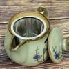 Kutani ware teapot with flower and bird design and net, AK4-0572