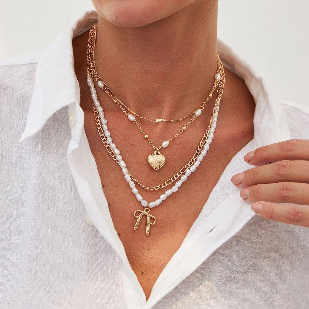 

PuRui Модный набор из 4 предметов Золотистый цвет Романтическое ожерелье из сплава с имитацией циркона для женщин Кулон в форме бантика и сердца Циркон Подарок