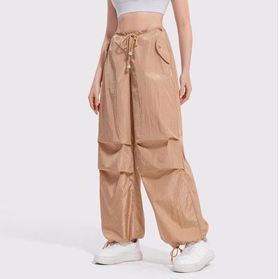 Women's Y2K Wide-Leg Cargo Pants with Drawstring - Slimming American Parachute Design for Casual Sport.