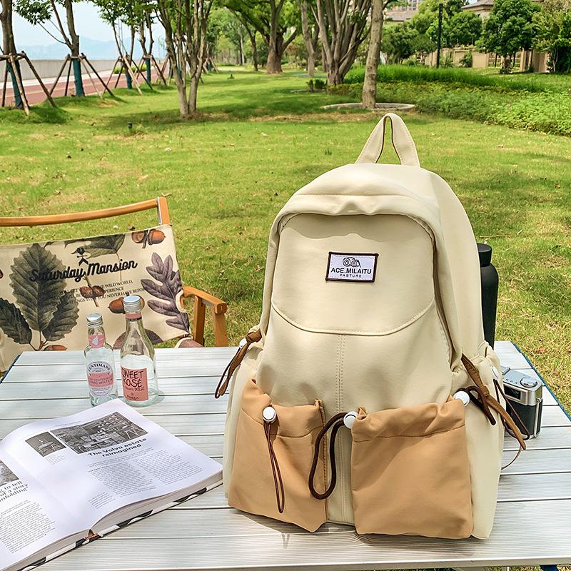 New high-value college-style men's and women's schoolbags, Korean version school students, contrasting colors, casual commuting, versatile backpack.