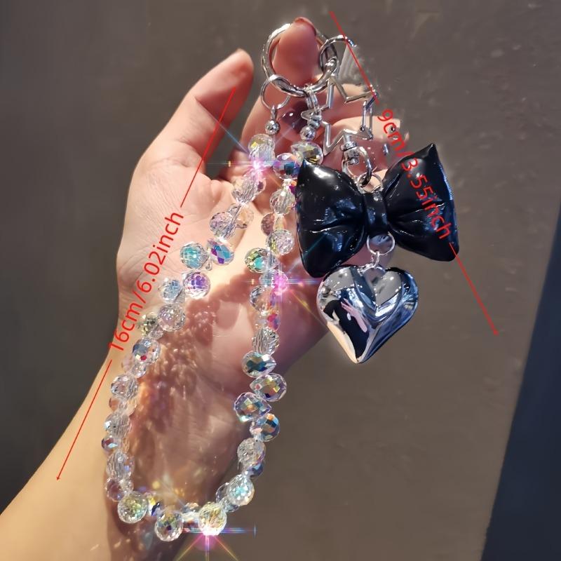 Ins style beaded phone wrist chain, love tie design, universal anti-lost short pendant lanyard for women outdoor shopping travel.