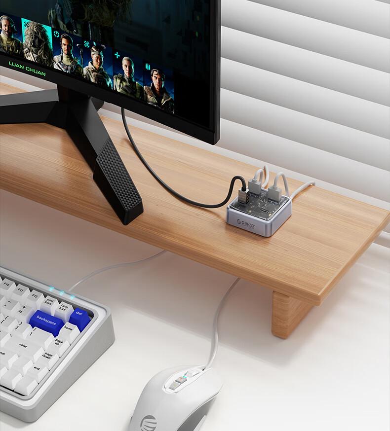 Orico MH4UC Multi-Port Fast Charging Hub with Direct Plug-In and U Disk Compatibility for Desktop, Notebook, and Tablet TC Port.