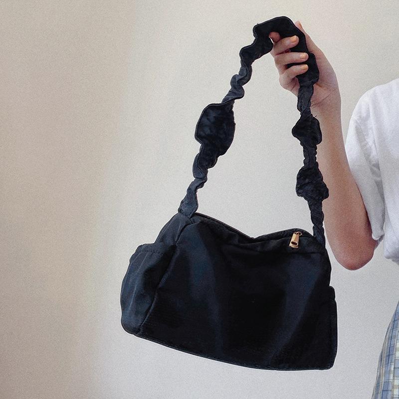 Nylon wrinkle design handbag simple solid color dark retro baguette bag new women's shoulder armpit bag