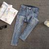 Jeans Skinny Denim Dimagranti Strappati con Perline Europee per Donna - Collezione Estate 2026