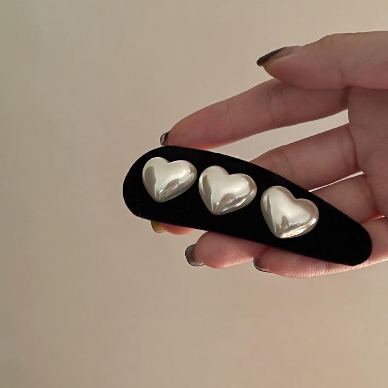 Premium Love Heart Hårnål: Elegant hårklipp for kvinner med enkel vanndråpedesign for elegant stil