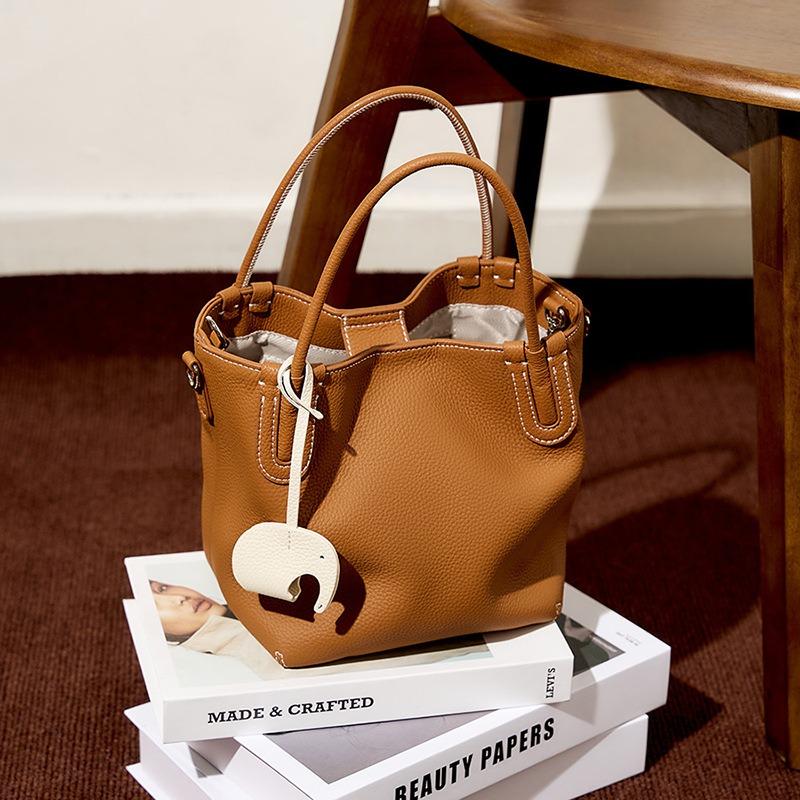 Summer new fashion leather bucket bag niche first layer cowhide retro single shoulder diagonal span portable vegetable basket bag