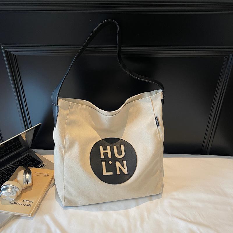 

Canvas bag women s large capacity 2025 summer new fashion simple messenger bag shoulder bag commuter tote bag бежевий