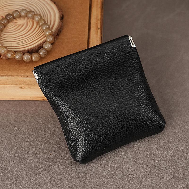 

Кошелек для монет из натуральной кожи с пружинным зажимом из сплава и застежкой-поцелуйчиком для хранения ключей, наушников или украшений чёрный