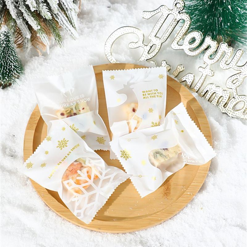 100Pcs 7x10cm Plastic Christmas Machine Sealed Bags Snowflake Pastry Candy Cookie Xmas Party Gift Packaging Supplies
