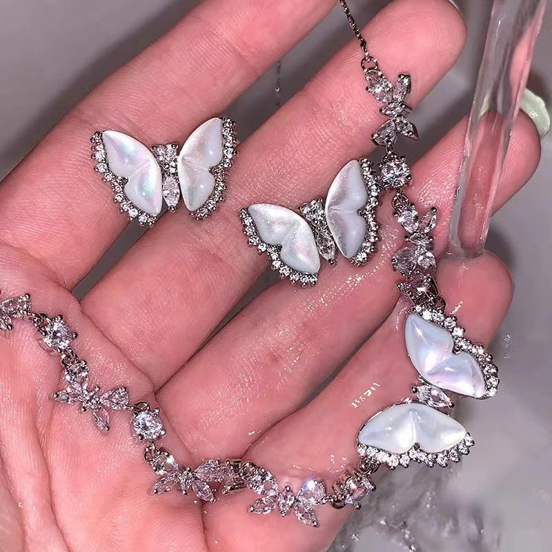 

2024 Diamond-Studded Butterfly Pearl Stud Earrings & Sweater Chain for Women