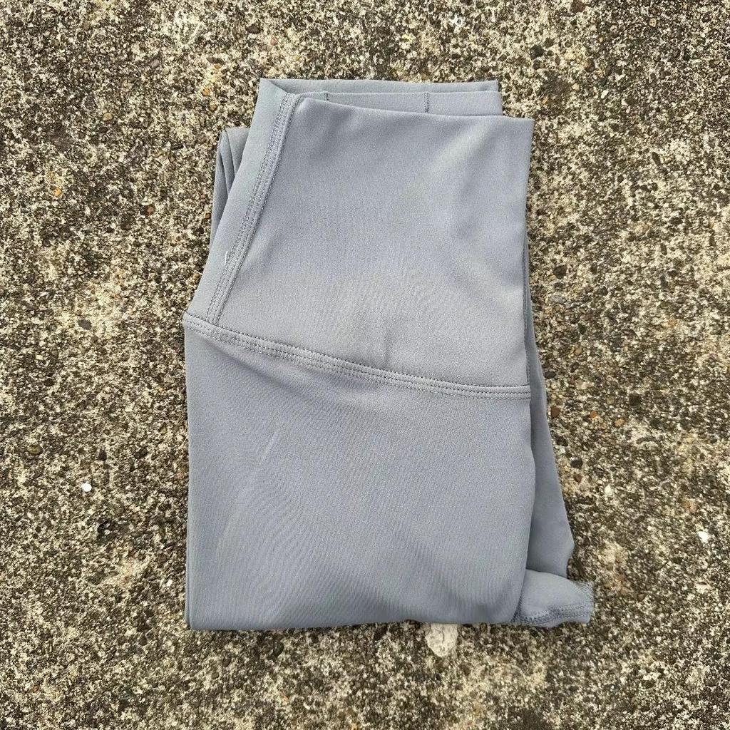 Solid Color High-Waisted Women's Yoga Leggings with Back Pocket – Soft, Elastic, and Peach Bum Enhancing