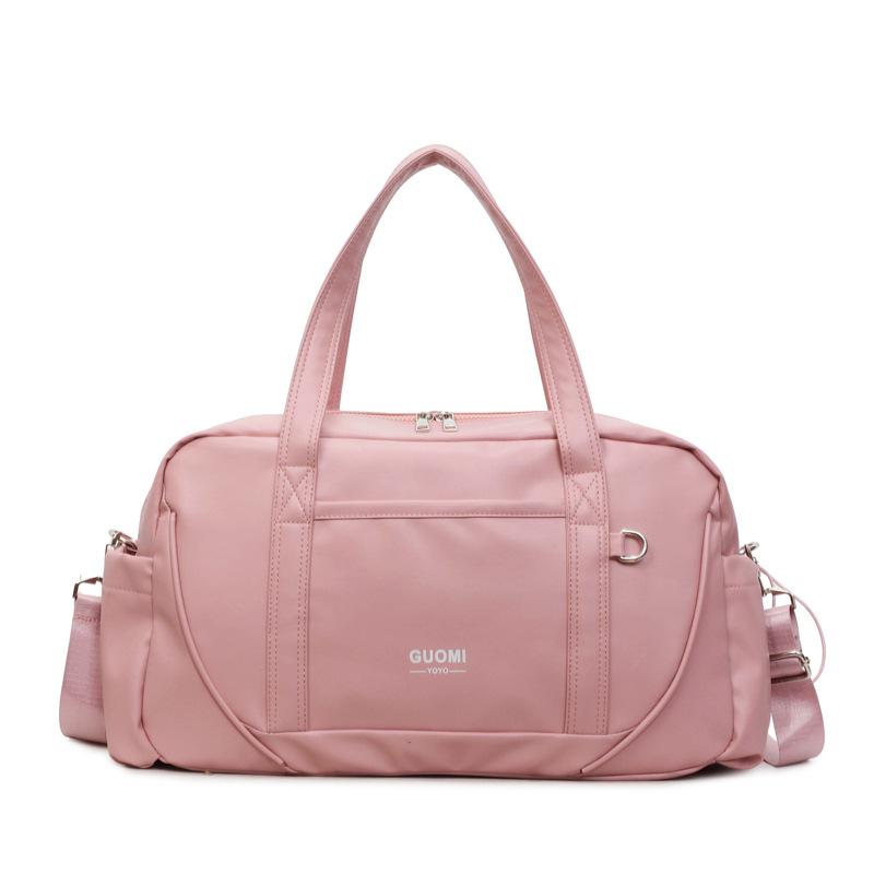 

Large Capacity Travel Duffel Bag with Dual Handles and Shoulder Strap Practical Weekender Bag for Men and Women рожевий