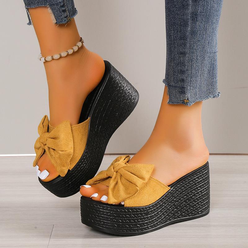 Sandals women spring and summer new slope heel thick bottom go out bow slippers fashion one word drag women