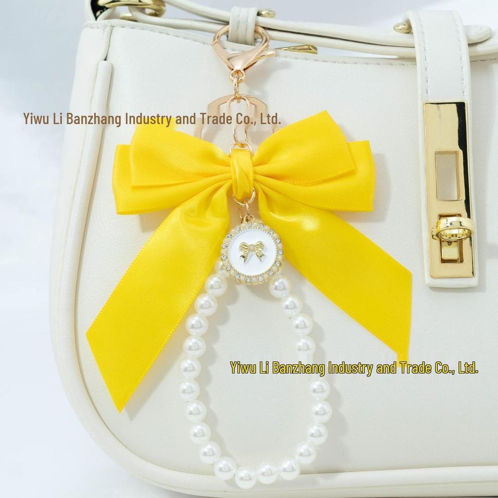 Large Bow Faux Pearl Bracelet Keychain with Colored Woven Strap and Alloy Tag Pendant