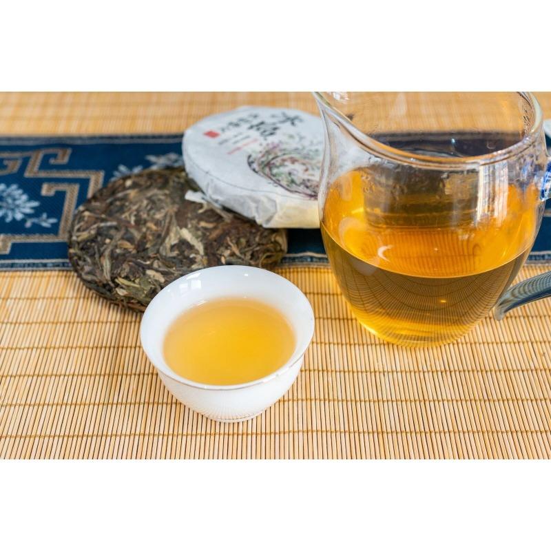 100g Pu'er Raw Tea Iceland Yunnan Ancient Tea Spring Tea Cake Orchid Fragrance