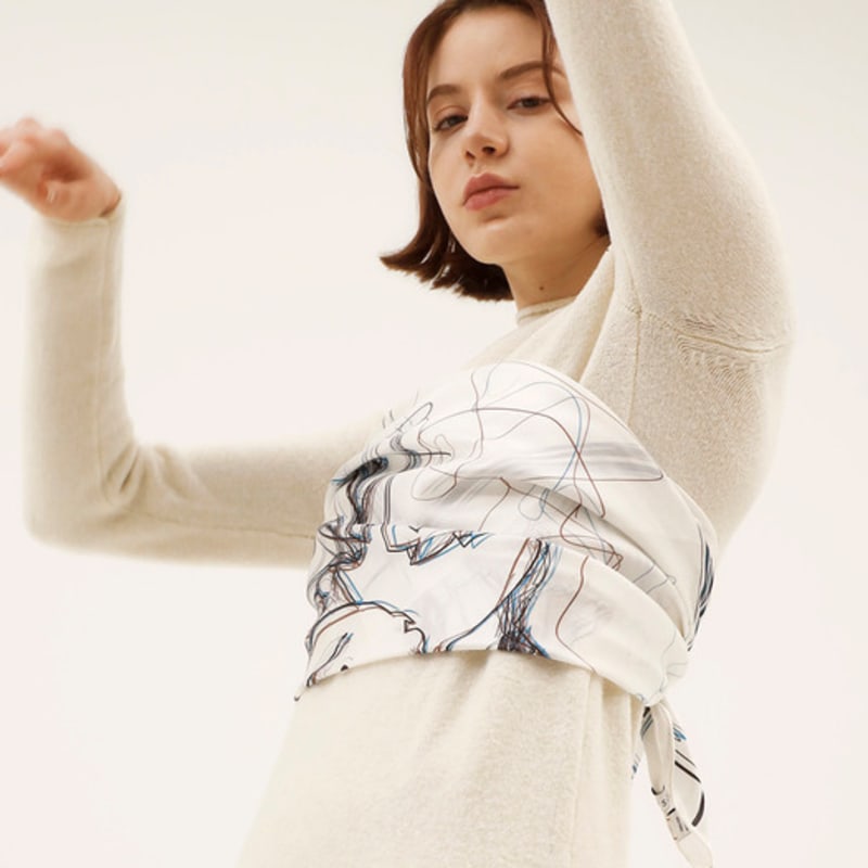 Woman wearing ONSZ hat and silk scarf