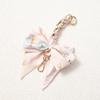 Elegant Hand-Woven Scarf Chain with Bow Decoration Pendant for Bag Strap Modification.