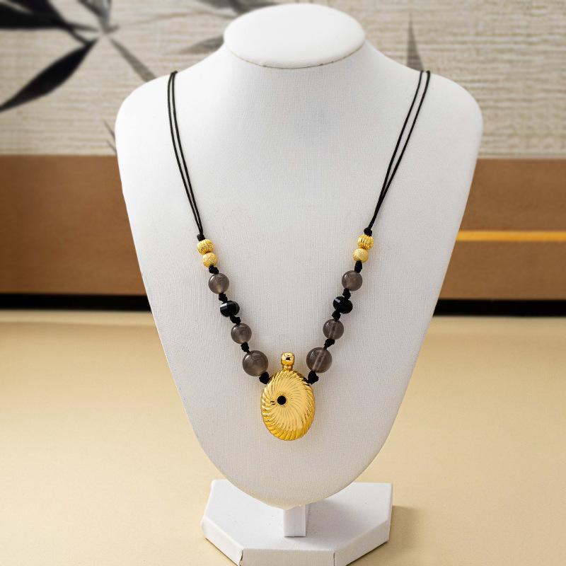Autumn and winter perfume bottle swirl beaded necklace women's retro temperament high sense elegant niche design sweater chain