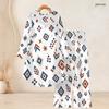 Women Plus Size Round Neck Long Sleeve Printed High Low Top Wide Leg Pants Two Piece Set