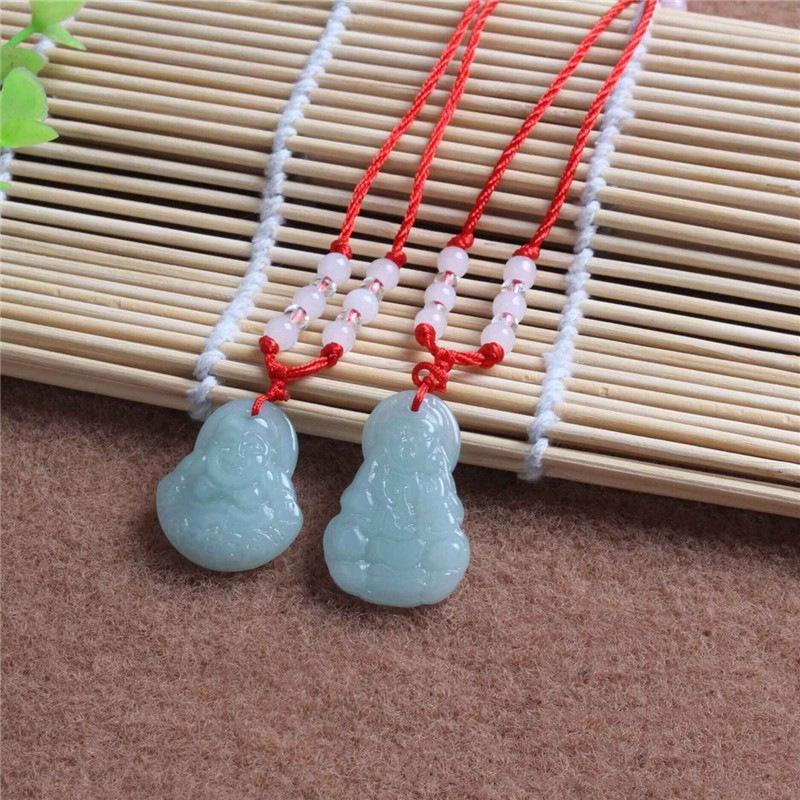 Hetian Jade Guanyin Buddha Pendant Necklace with Red String and Eight Bead Design.
