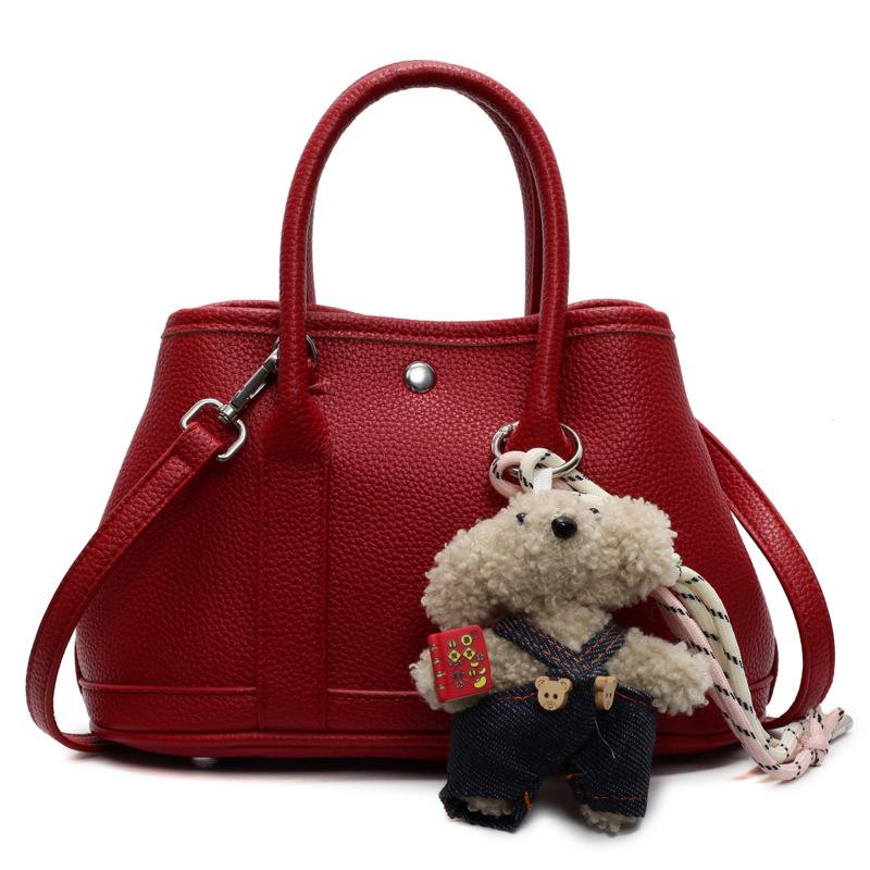 2025 New Niche Simple Leisure Commuter Portable Bucket Bag Versatile Solid Color Child and Mother Bag Messenger Bag Bag