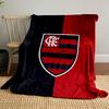 A vertically split black and red background with a striped shield emblem. for all seasons blanket lunch break throw gift