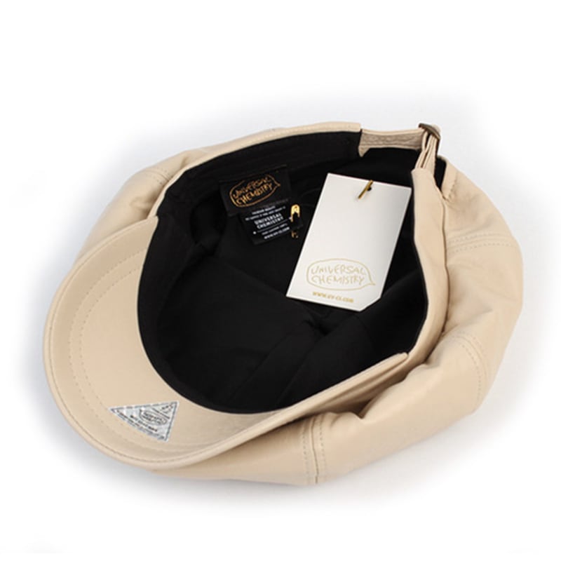 Universal chemistry Crack Leather Ivory Belted Newsboy Cap