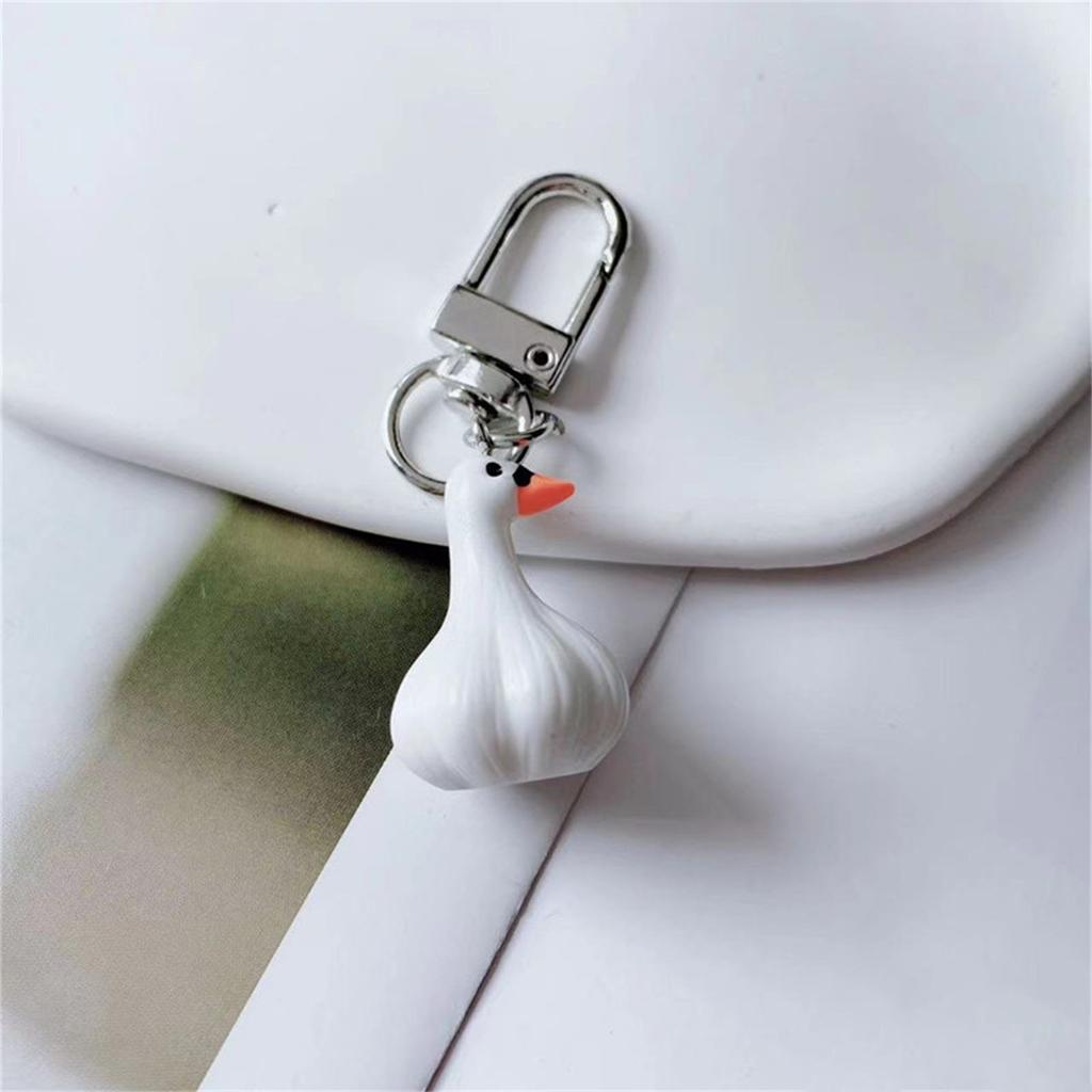 Kreativer Knoblauchförmiger Schlüsselanhänger Knoblauch-Enten-Schlüsselanhänger Blickfangendes Schlüsselzubehör Cartoon-Schlüsselhalter Geeignet für den Alltag